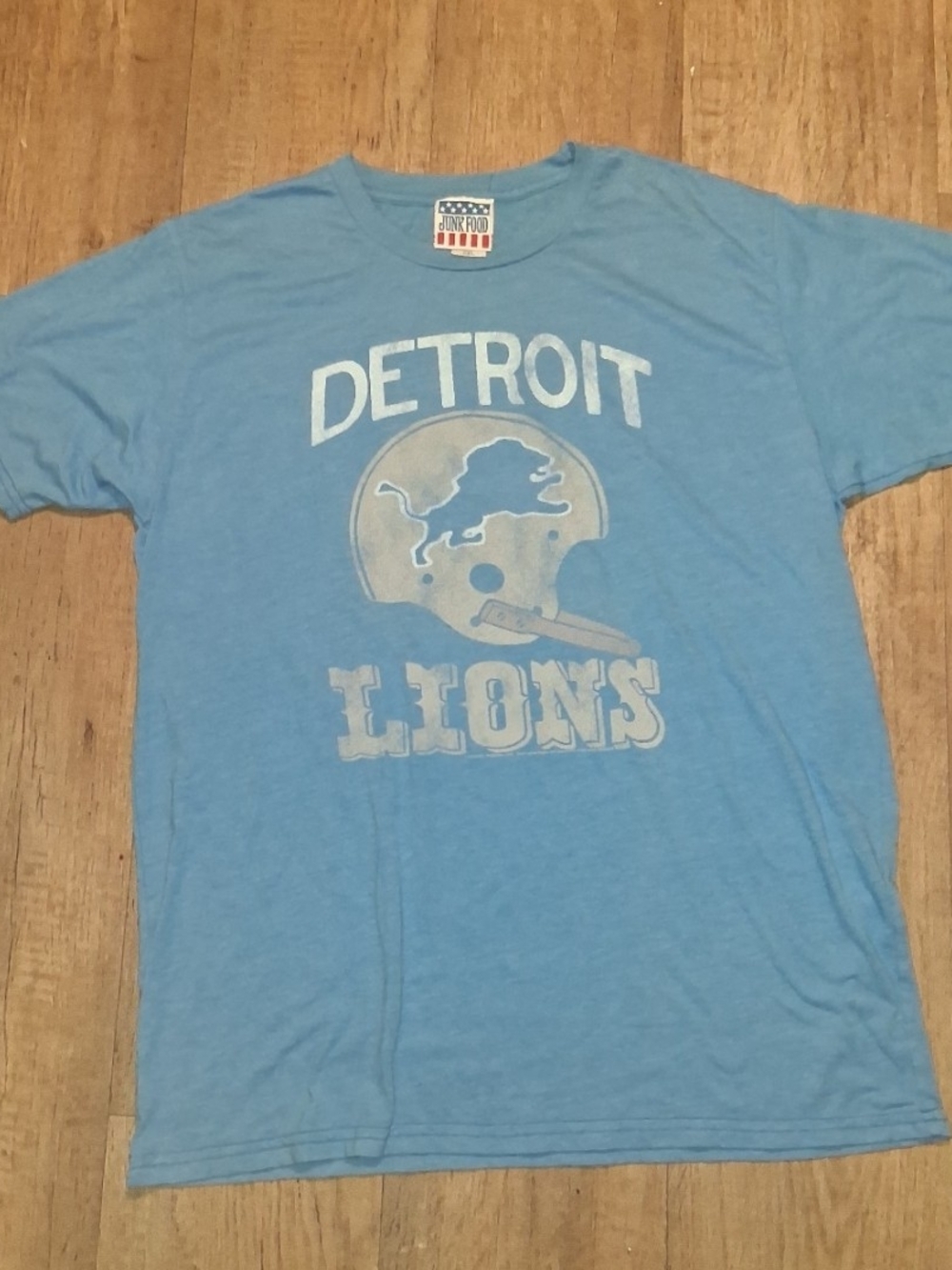 Junk Food Clothing.Design: Light blue short-sleeve tee featuring a vintage,
